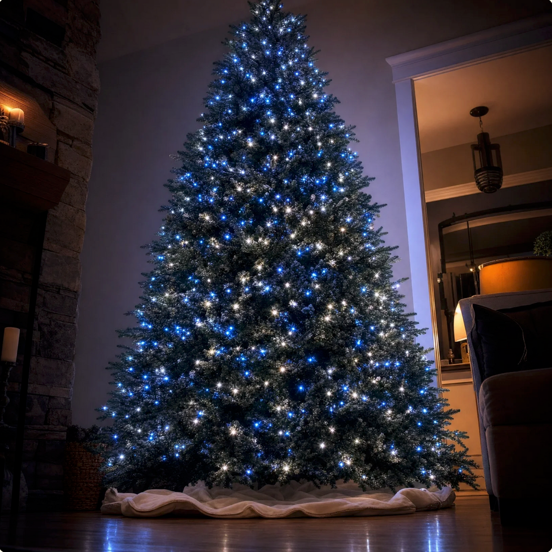 Tall Christmas tree lit with blue and warm white lights